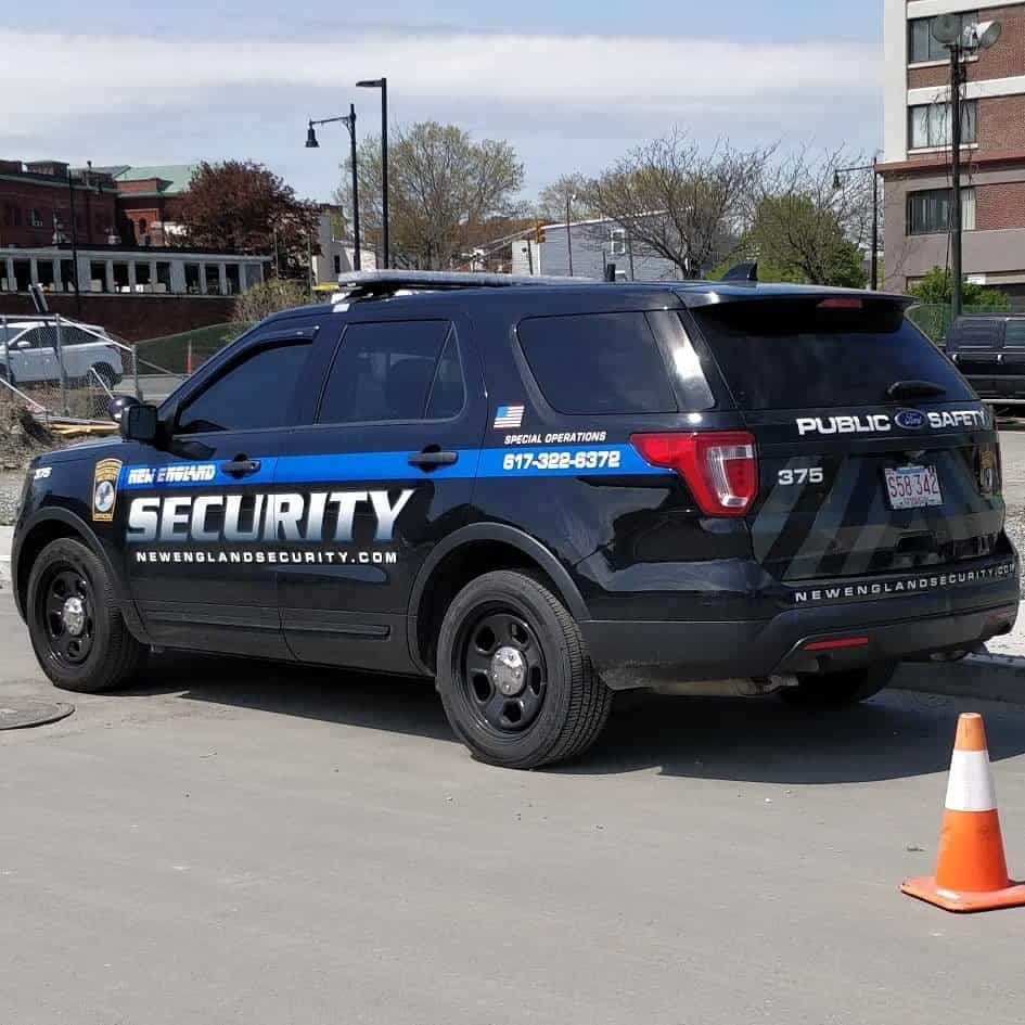 New England Security patrol vehicle resembling law enforcement, with LED light bars, for crime deterrence